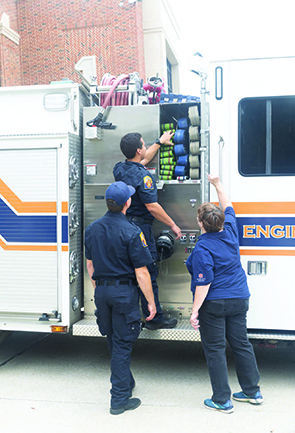 JoEllen Sefton works with members of the Auburn Fire Department.