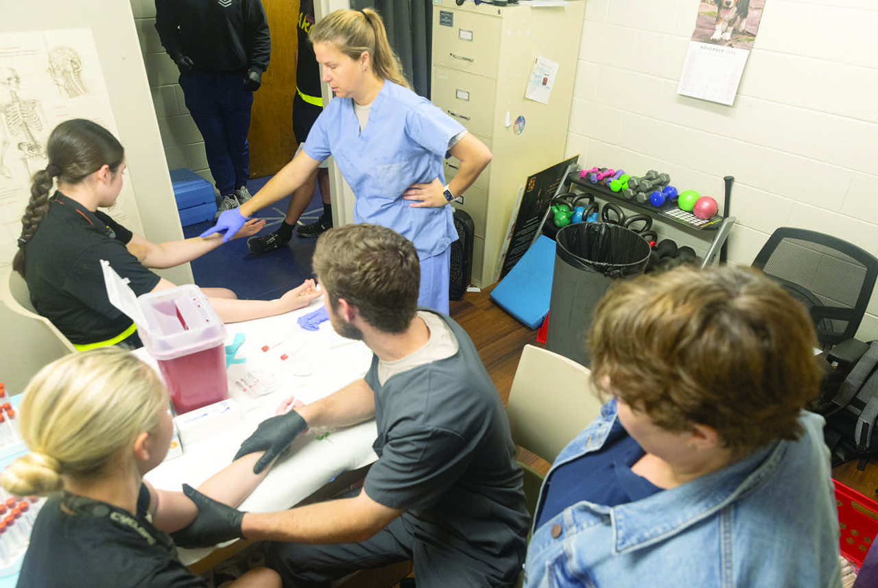 JoEllen Sefton and members of the Warrior Research Center collect bloodwork from Army soldiers.