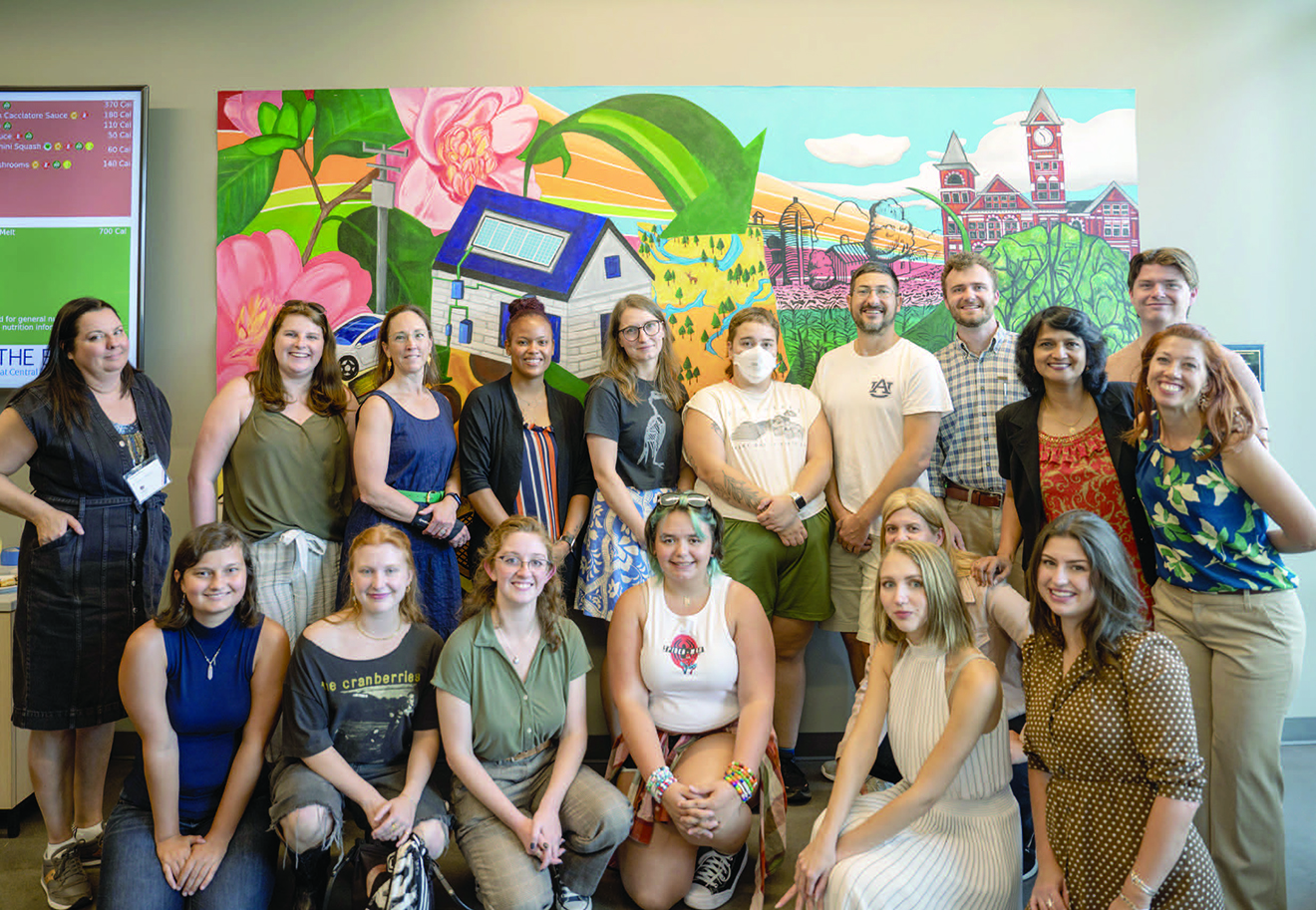 Faculty and students celebrate the completion of the mural