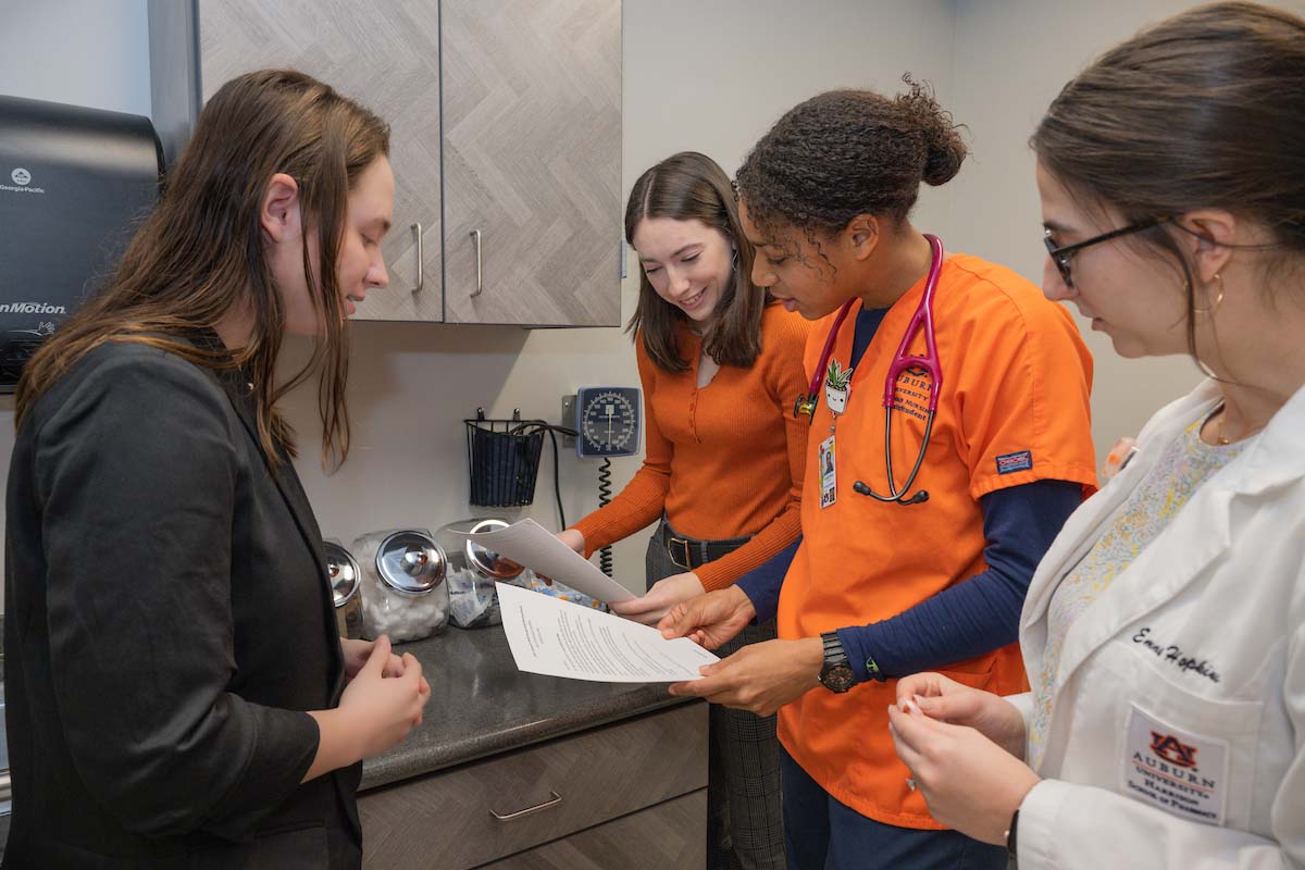 College of Nursing students reviewing lab procedure list