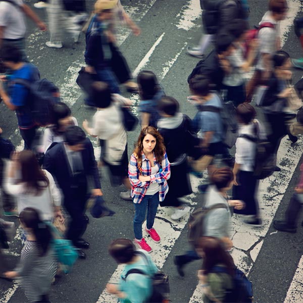 Several people walking in a city