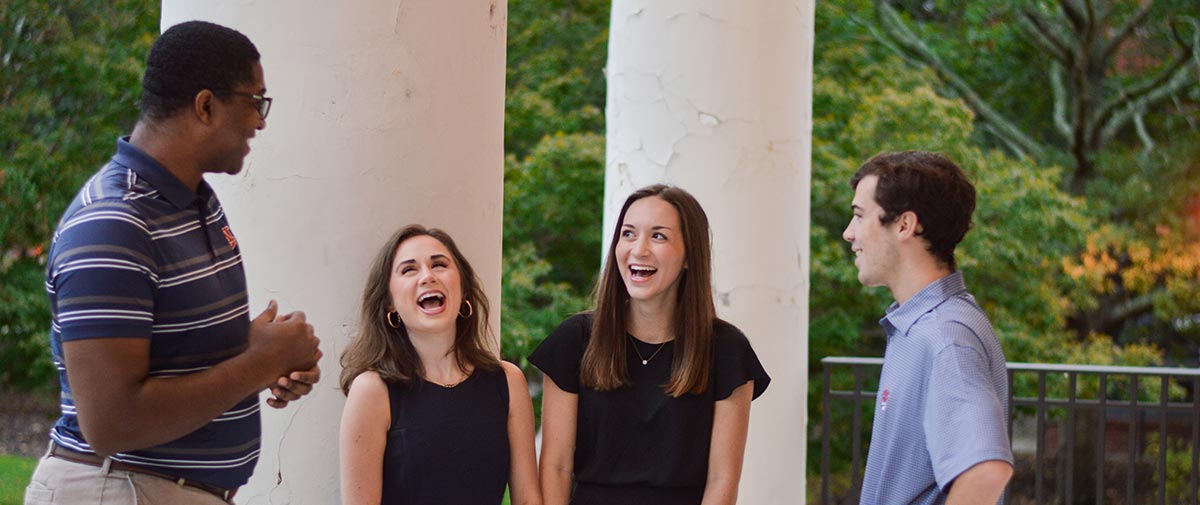 Students sit on a bench
