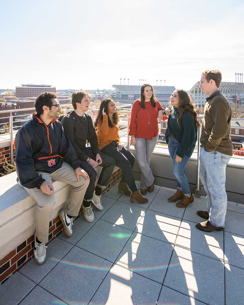 Several students on a balcony