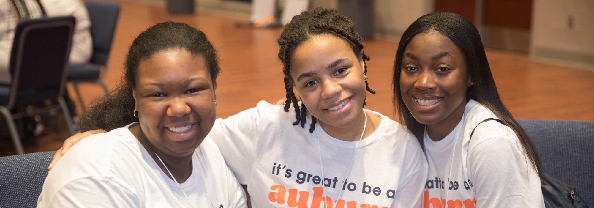 Three students pose for a photo