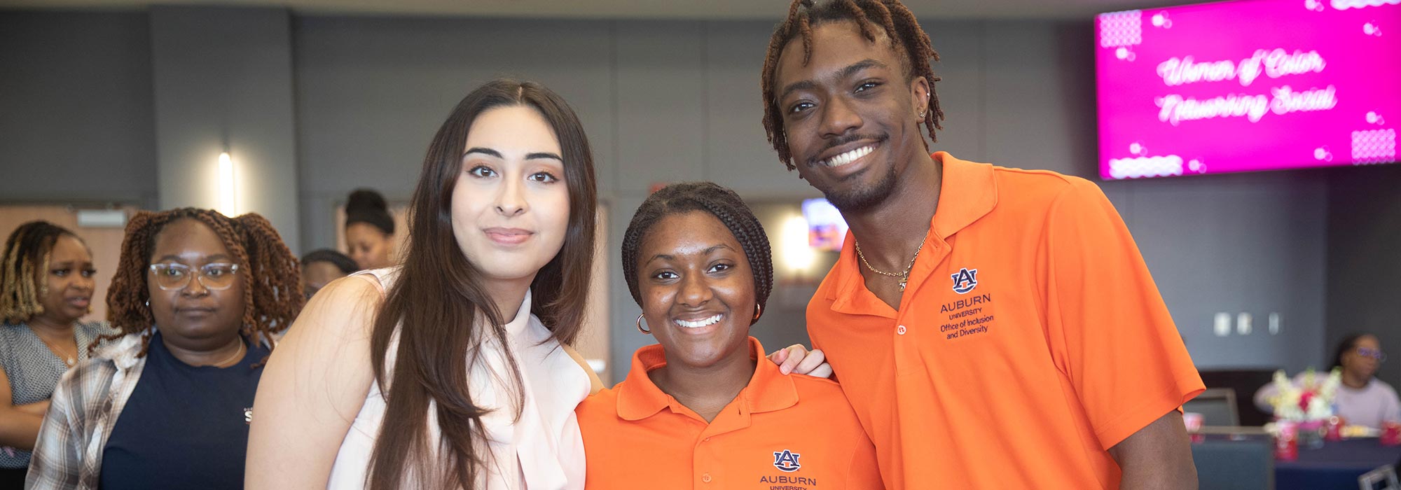Three students pose