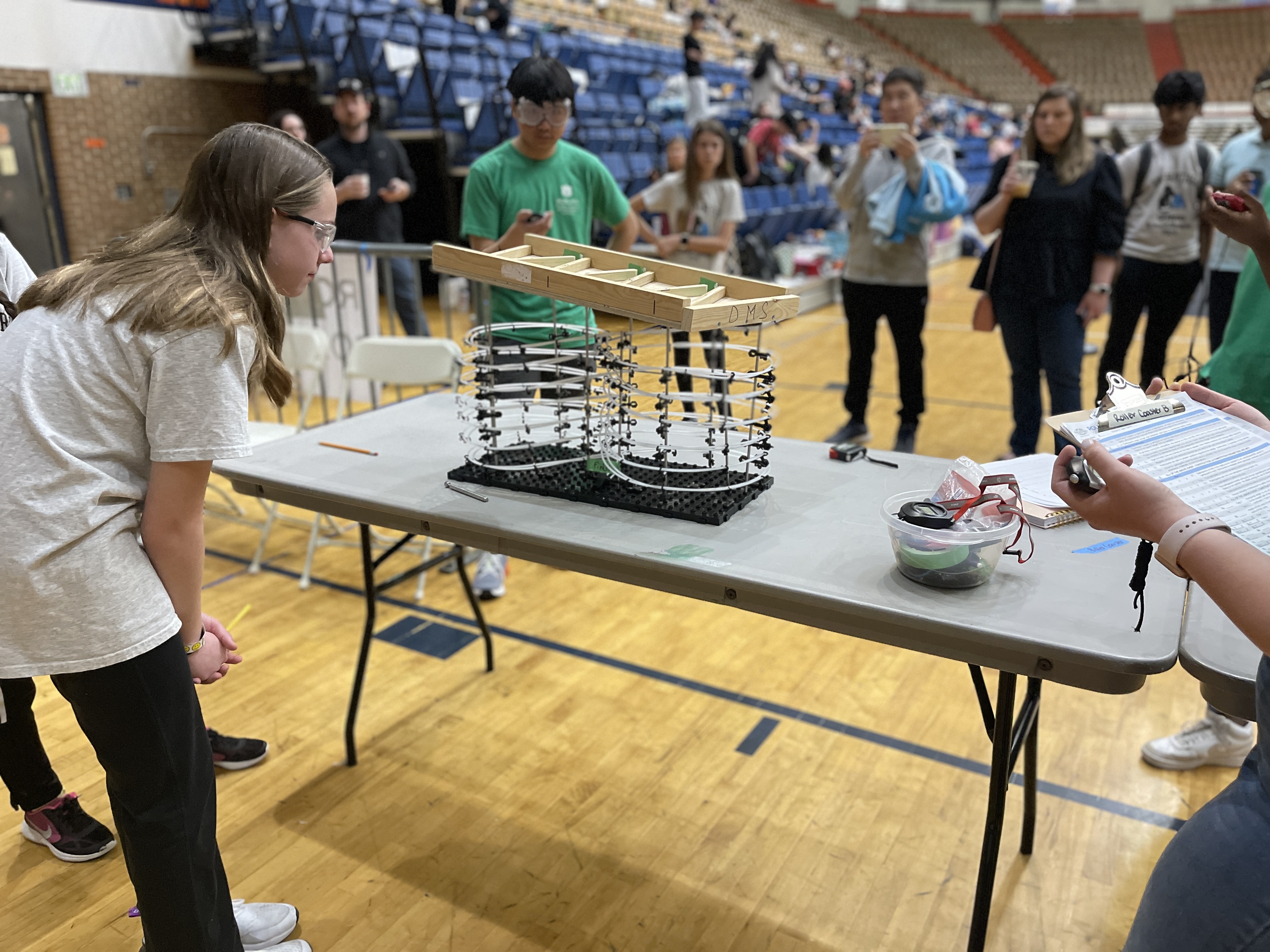 Students participate in the roller coaster event.