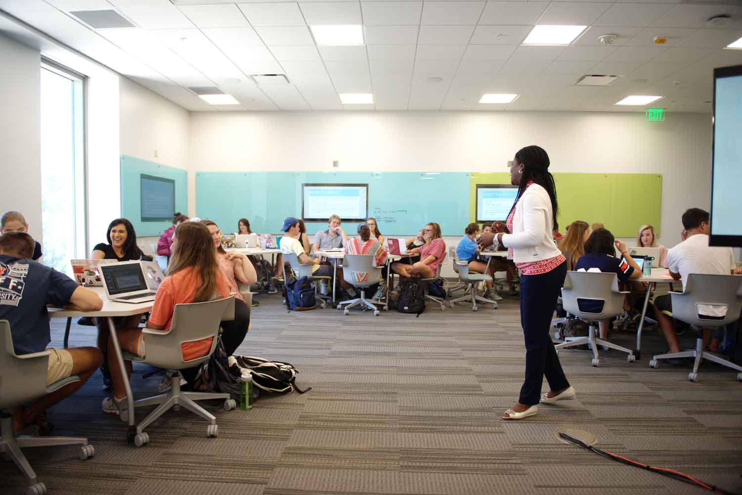 Teacher presenting to a class in Mell classroom.