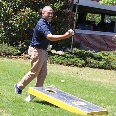 Staff members enjoying a game of cornhole during OIT's Employee Appreciation Day