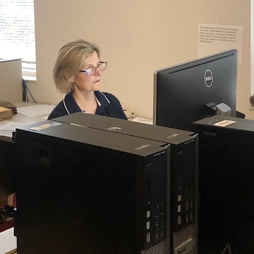 A member of the endpoint support team working on her computer
