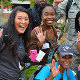 Students waving