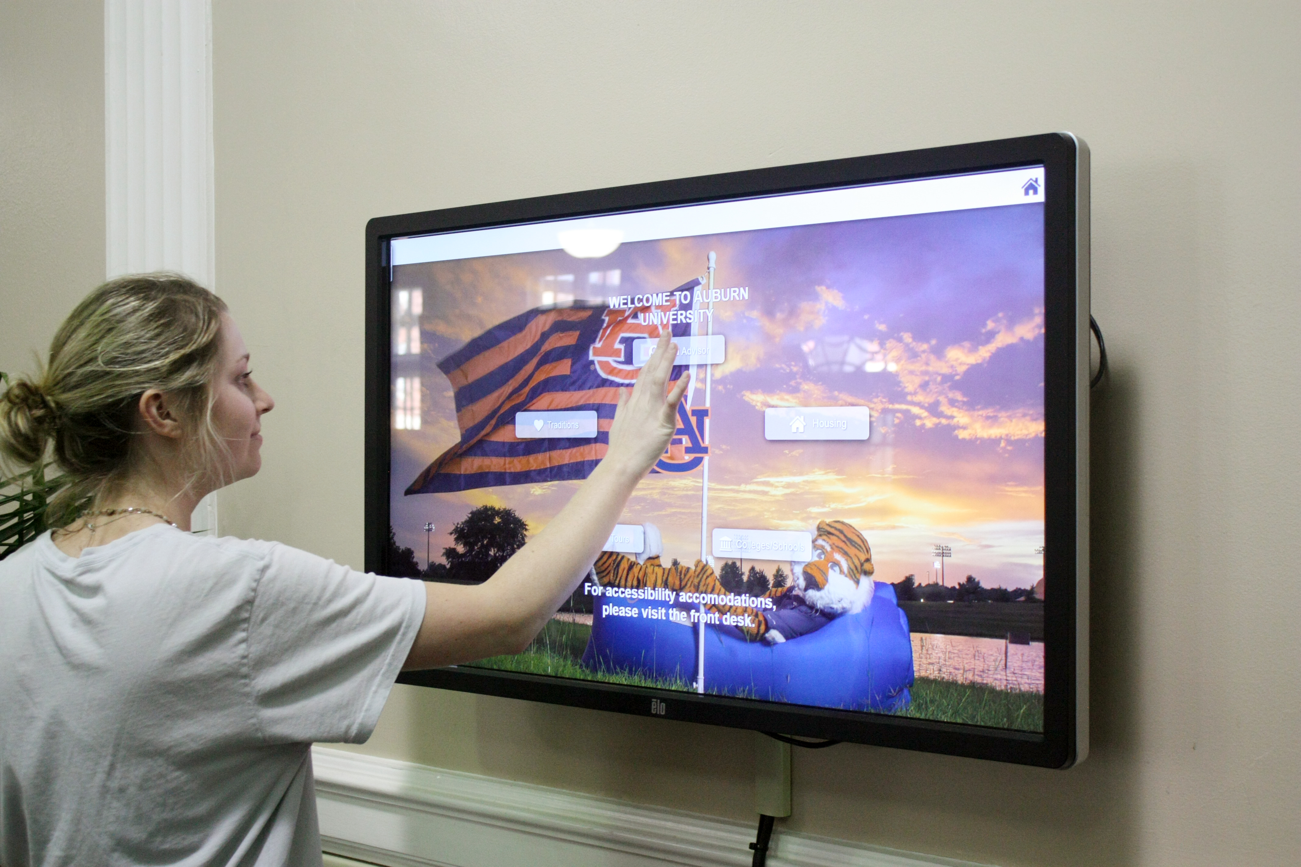 Students looking through the interactive screen