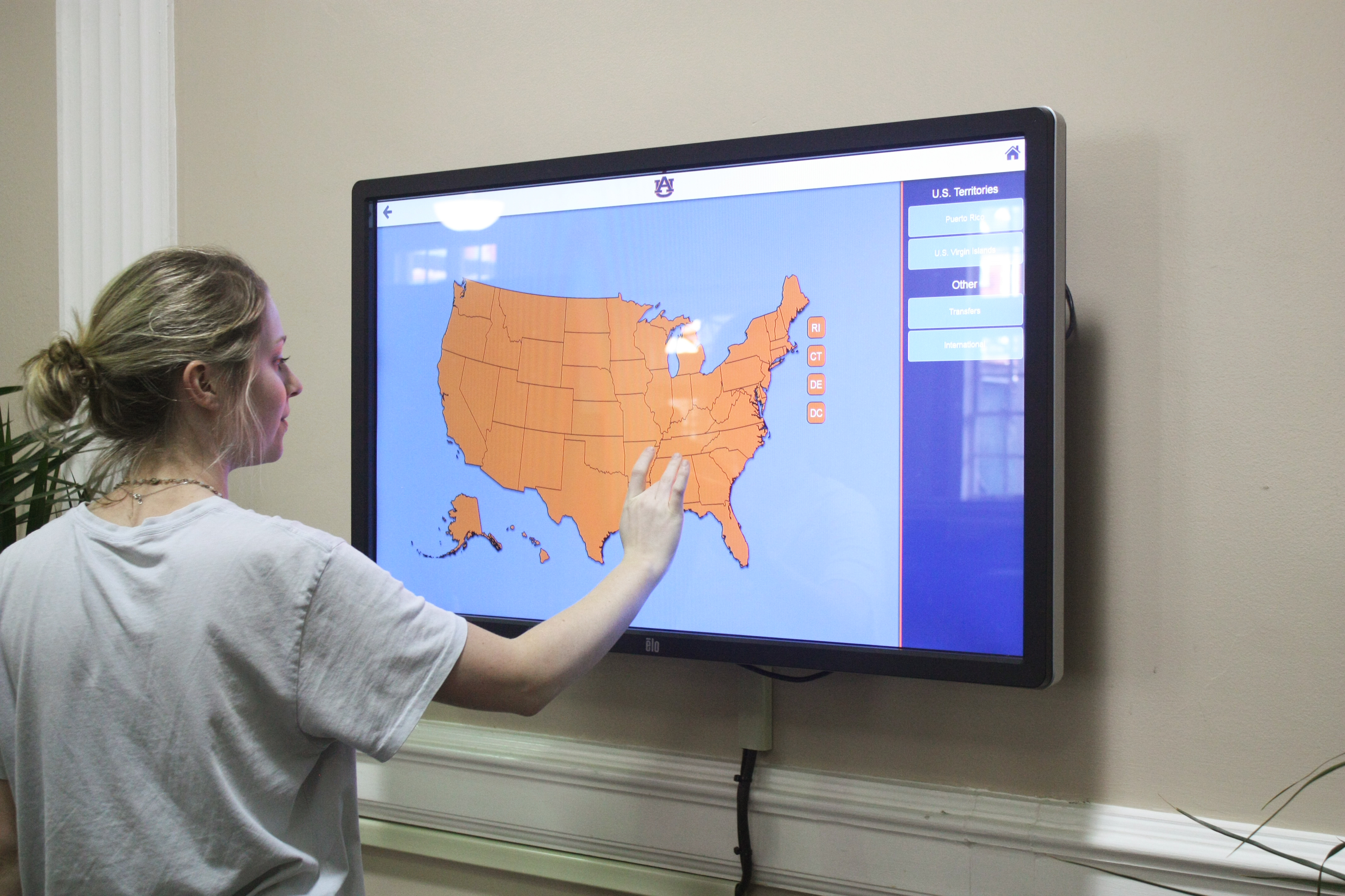 Students looking through the interactive screen