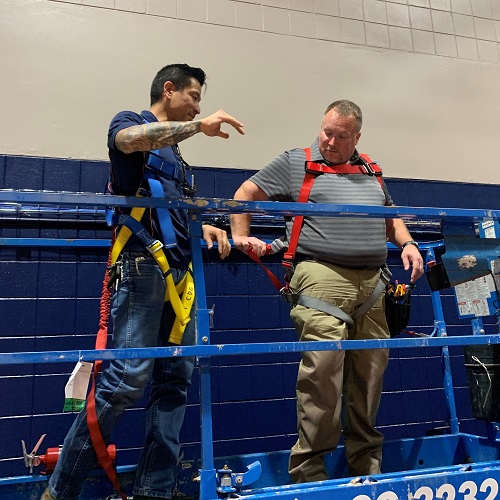 Members of the MMCD on a lift in the Student ACT