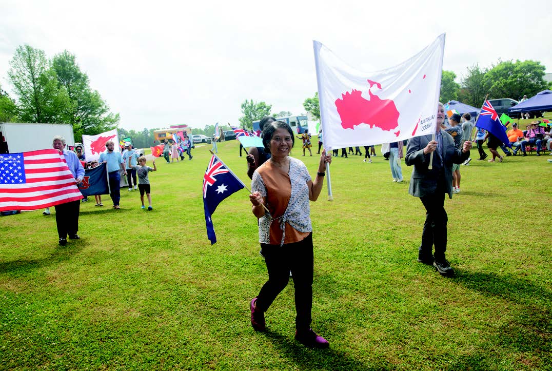 Global Community Day members with Australia flag