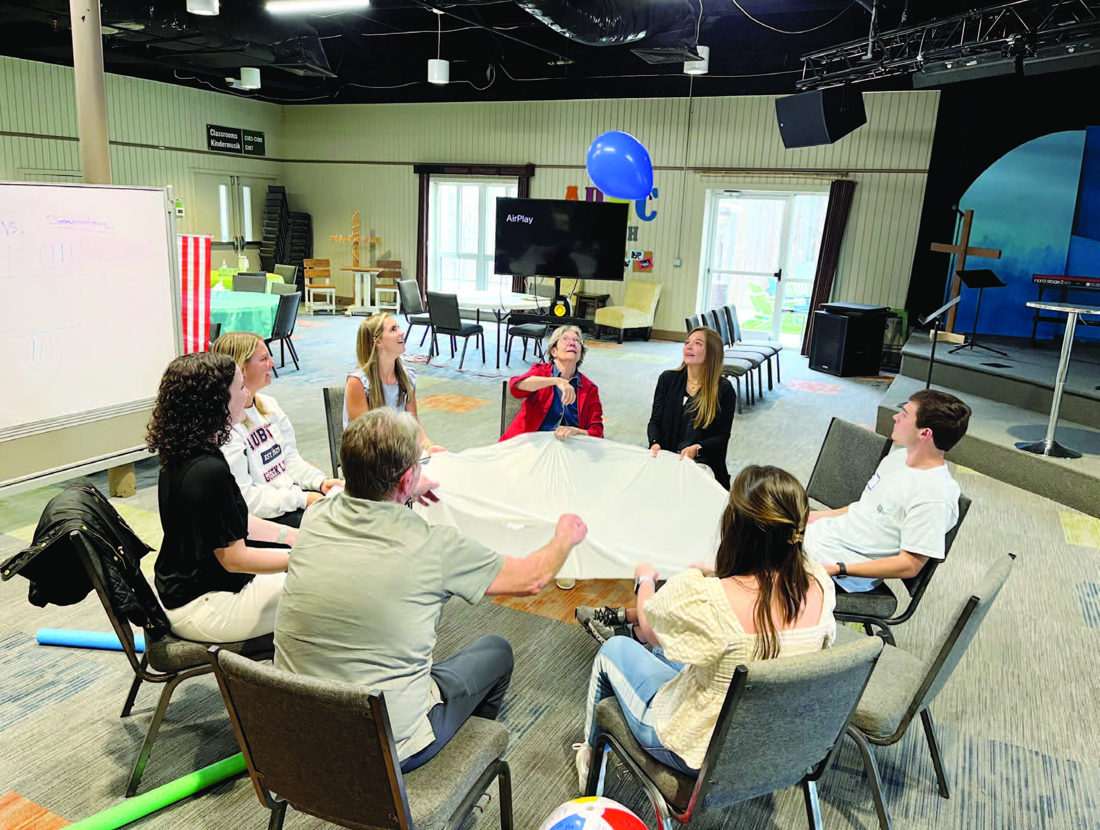 SLP students lead REACH participants in a game.