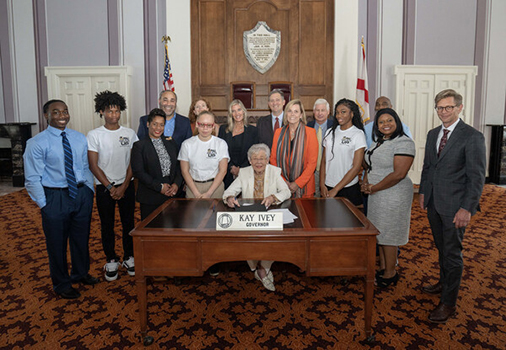 GEAR UP Achieve leadership team, GEAR UP ASU, and GEAR UP Jefferson County representatives with Governor Kay Ivey signing proclamation for GEAR UP week