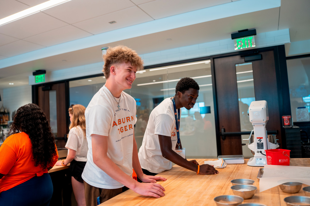 Two classmates working together on a group project.