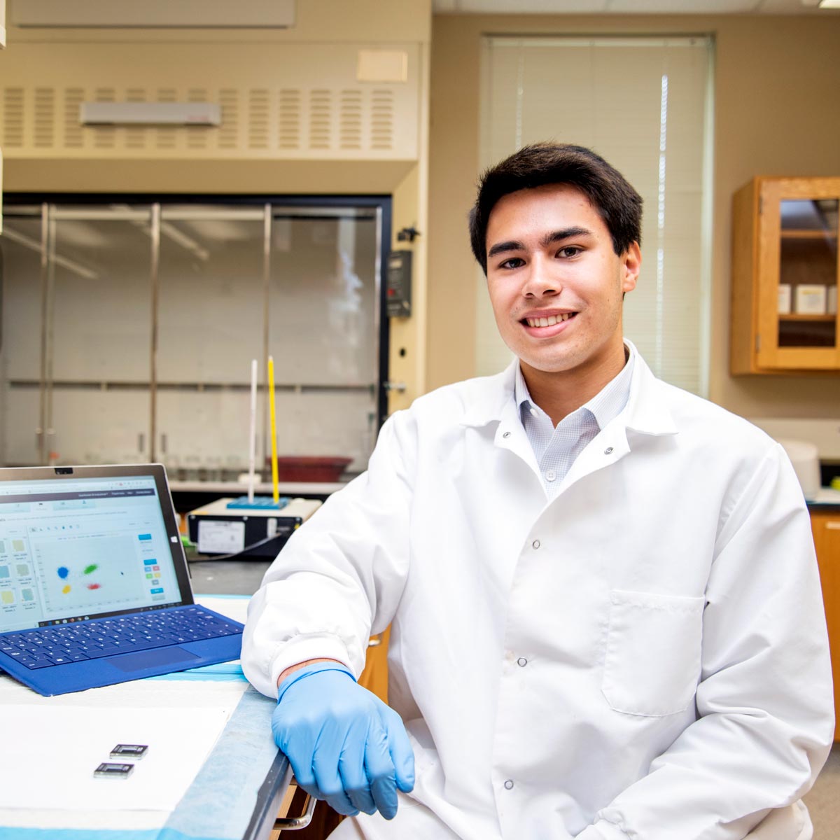 Male student in nutrition science lab.