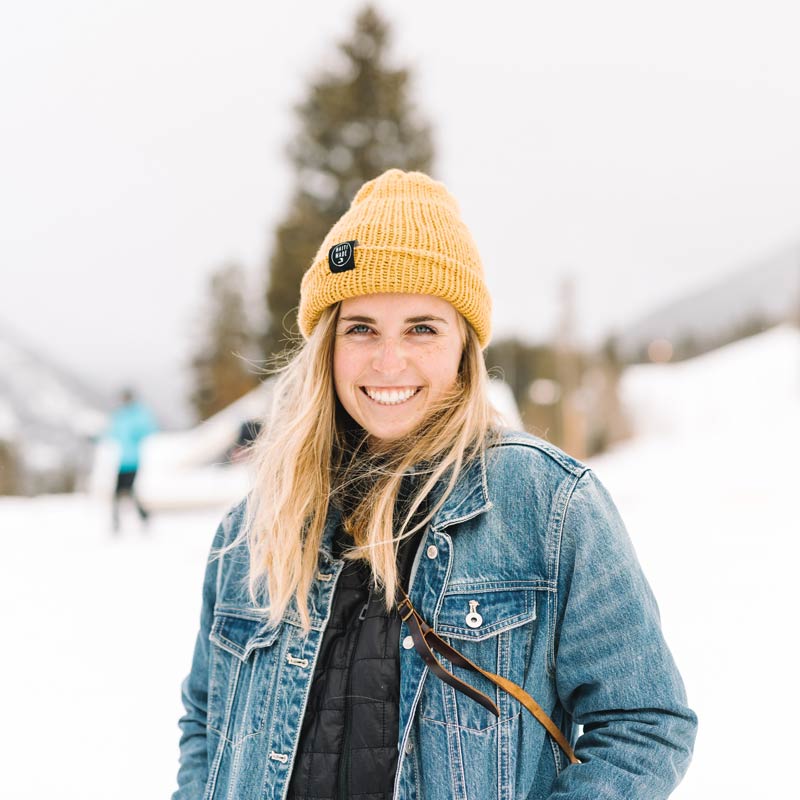Samantha Ponder smiling with a yellow knit hat and blue jean jacket on.