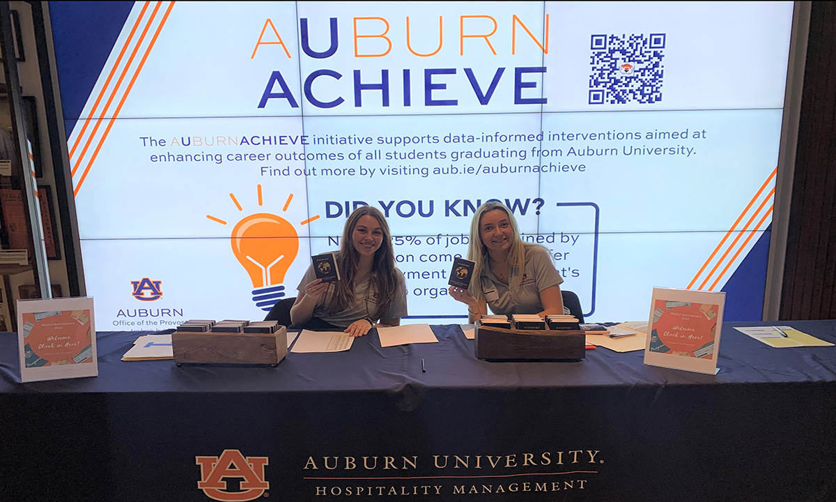  Auburn Sustenance Project members working filling paper grocery bags