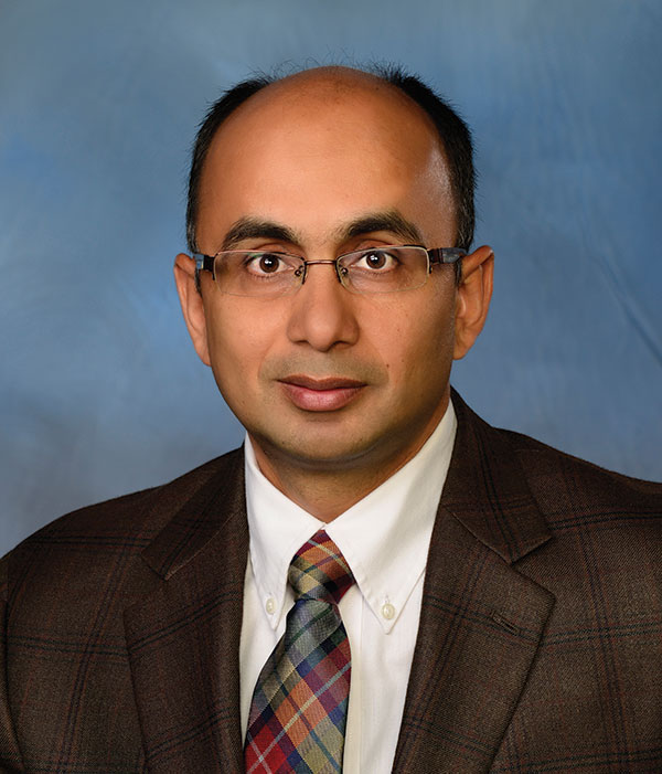Portrait photograph of Sushil Adhikari
