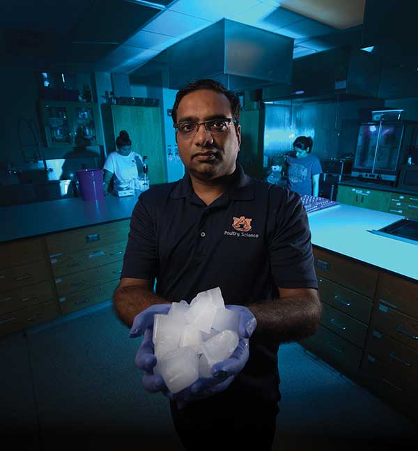 A man holds a block of ice