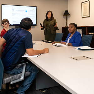 Conference Meeting Room with Students and a Professor
