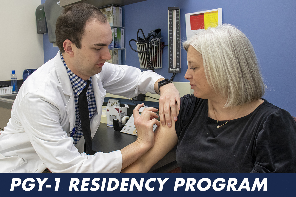 Resident gives flu shot