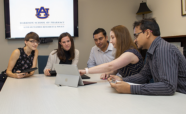 faculty and students in a classroom