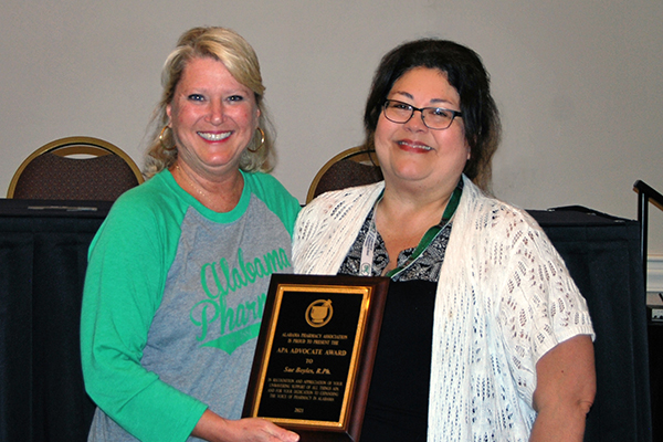 Louise Jones and Sue Boyles hold the award