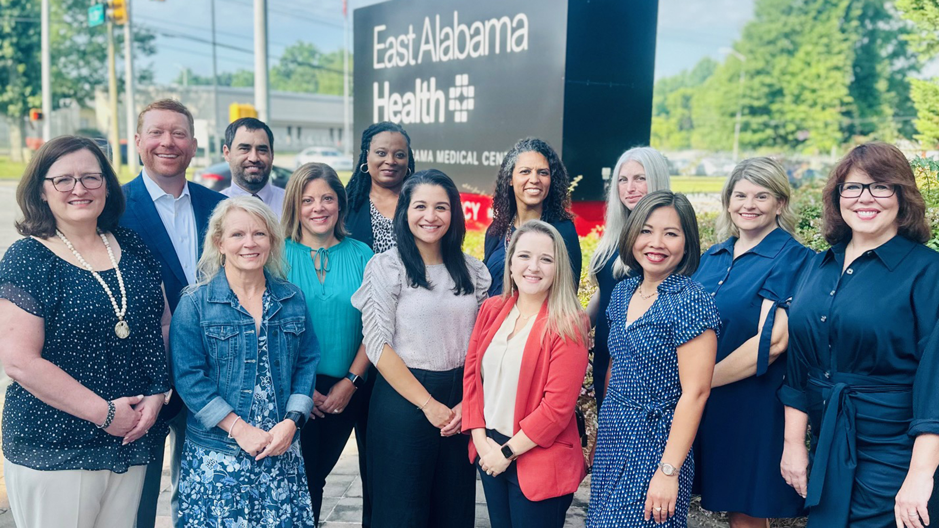 Group photo in front of hospital sign