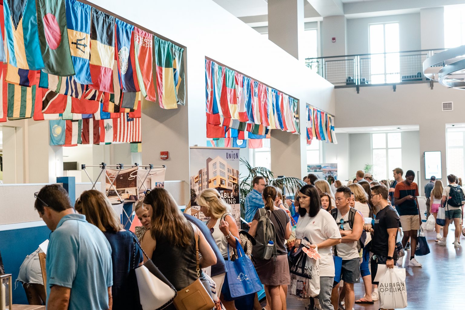 Line of people visiting the business fair inside the student center