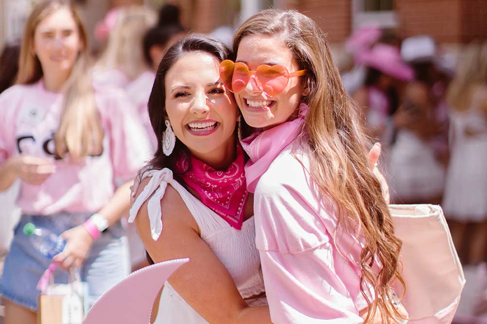 Two sorority members smiling