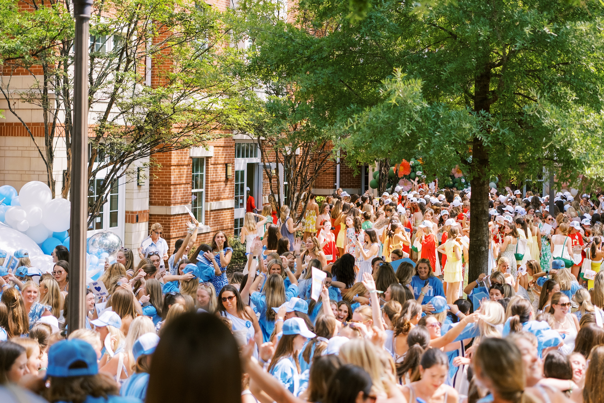 sorority students gather outside Neville arena for bid day