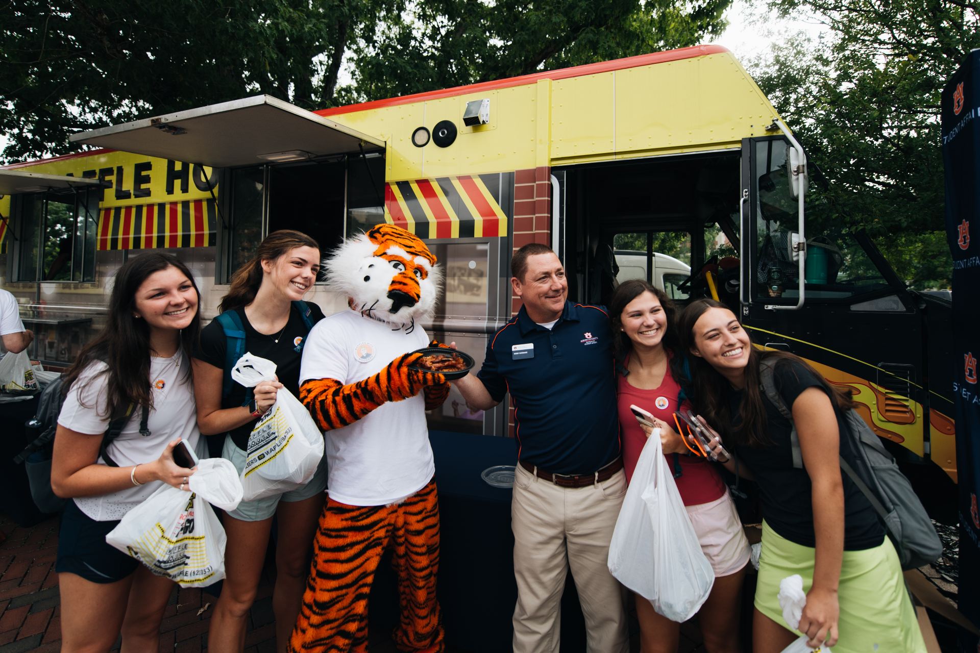 students with Dr. Woodard and Aubie at the Waffles with Woodard event